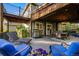 Under deck patio with outdoor seating, dining, and grill at 10188 Stephen Pl, Highlands Ranch, CO 80130