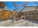 Cozy fenced backyard with bench and patio space, perfect for relaxing at 14462 E Mississippi Ave # B, Aurora, CO 80012