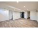 Spacious basement with modern vinyl plank flooring and recessed lighting at 14462 E Mississippi Ave # B, Aurora, CO 80012