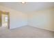 Bedroom featuring a closet and neutral carpet flooring at 14462 E Mississippi Ave # B, Aurora, CO 80012