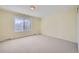 Bedroom with neutral carpet, a window with blinds, and baseboard vents at 14462 E Mississippi Ave # B, Aurora, CO 80012