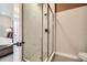 Modern bathroom with glass shower enclosure and marble-style tile at 16559 Peak Way, Broomfield, CO 80023