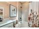 Bathroom with a bathtub, herringbone tile, and floral shower curtain at 16559 Peak Way, Broomfield, CO 80023