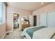 Well-lit bedroom with ensuite bathroom and closet at 16559 Peak Way, Broomfield, CO 80023