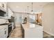 Modern kitchen with island and stainless steel appliances at 16559 Peak Way, Broomfield, CO 80023