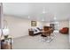 Wide view of a finished basement with modern furniture and wet bar at 3308 S Birch St, Denver, CO 80222