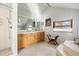 Bright bathroom featuring a tiled shower, large vanity, and soaking tub at 3308 S Birch St, Denver, CO 80222