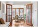 Dining room with hardwood floors and ample natural light through large windows at 3308 S Birch St, Denver, CO 80222