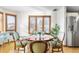 Dining area with hardwood floors and natural lighting in a bright and airy space at 3308 S Birch St, Denver, CO 80222