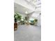 Bright and airy living room featuring tile floors and multiple plants that are arranged in a visually pleasing manner at 3308 S Birch St, Denver, CO 80222