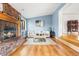 Spacious living room with brick fireplace, hardwood floors, and natural light at 3308 S Birch St, Denver, CO 80222