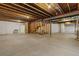 Unfinished basement ready for customization with exposed beams and ample space for storage or recreation at 6597 Club Villa Rd, Parker, CO 80134