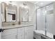 Stylish bathroom features double vanity, modern fixtures, and a glass-enclosed shower at 2140 S Ash St # 102, Denver, CO 80222