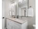 Elegant bathroom vanity with double sinks, modern fixtures, and ample counter space at 2140 S Ash St # 102, Denver, CO 80222