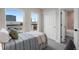 Comfortable bedroom with large windows, carpet, and closet, offering ample storage space at 2140 S Ash St # 102, Denver, CO 80222