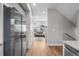 Open hallway leads to the living area, kitchen and staircase at 2140 S Ash St # 102, Denver, CO 80222