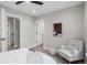 Spacious main bedroom features ample natural light and comfortable seating area at 2140 S Ash St # 102, Denver, CO 80222