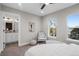 Relaxing main bedroom shows ensuite bathroom and ample natural light from large windows at 2140 S Ash St # 102, Denver, CO 80222