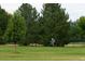 Scenic park view with mature trees and a cyclist enjoying the outdoors at 2140 S Ash St # 102, Denver, CO 80222