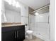 Bathroom featuring modern vanity, toilet and updated shower with glass enclosure at 1062 Rockhurst Dr # 302, Highlands Ranch, CO 80129