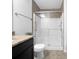 Bathroom featuring modern vanity, toilet and updated shower with glass enclosure at 1062 Rockhurst Dr # 302, Highlands Ranch, CO 80129