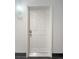Apartment 302 featuring a white door and modern light fixture at 1062 Rockhurst Dr # 302, Highlands Ranch, CO 80129