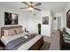 Stylishly staged primary bedroom with a neutral color palette, soft textures and decorative wall art at 1062 Rockhurst Dr # 302, Highlands Ranch, CO 80129