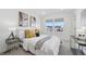 Cozy bedroom with a plush bed, stylish accents, and a large window offering natural light at 7812 W 43Rd Pl, Wheat Ridge, CO 80033