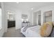 Bedroom featuring neutral colors, modern decor and bathroom access at 7812 W 43Rd Pl, Wheat Ridge, CO 80033