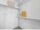 Well-organized closet with ample storage space, featuring shelves and rods for efficient organization at 7812 W 43Rd Pl, Wheat Ridge, CO 80033