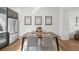 Dining area adjacent to kitchen, featuring modern table and stainless steel refrigerator at 7812 W 43Rd Pl, Wheat Ridge, CO 80033