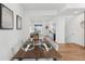 Inviting dining room with stylish decor, set for a meal, showcasing a modern and comfortable living space at 7812 W 43Rd Pl, Wheat Ridge, CO 80033