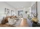 Cozy living room with modern decor, hardwood floors, and access to a balcony at 7812 W 43Rd Pl, Wheat Ridge, CO 80033