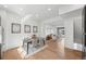 This open floor plan features a dining area with wood floors and a view of the living room at 7812 W 43Rd Pl, Wheat Ridge, CO 80033