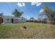 Lush backyard with spacious yard, grass lawn, fence, and home exterior at 3940 S Hazel Ct, Englewood, CO 80110