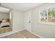 Charming bedroom boasts wood-look floors, natural light, and relaxing ambiance at 3940 S Hazel Ct, Englewood, CO 80110