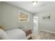 Cozy bedroom with a window view and wood-look flooring at 3940 S Hazel Ct, Englewood, CO 80110