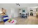 Open-concept living space with dining area and view into the updated kitchen at 3940 S Hazel Ct, Englewood, CO 80110