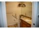 Bathroom with hanging plants, grab bars, and granite countertop at 2980 W Centennial Dr # L, Littleton, CO 80123