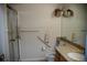 Bathroom with glass shower, grab bars, and granite countertop at 2980 W Centennial Dr # L, Littleton, CO 80123