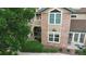 Beautiful multi-story building with brick accents and landscaped grounds at 2980 W Centennial Dr # L, Littleton, CO 80123