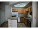 Modern kitchen with granite countertops and stainless steel appliances with ample storage at 2980 W Centennial Dr # L, Littleton, CO 80123