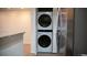 Convenient stackable washer and dryer unit tucked away in a closet at 2980 W Centennial Dr # L, Littleton, CO 80123