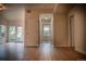 Bright living room with wood floors, white trim, and outdoor access at 2980 W Centennial Dr # L, Littleton, CO 80123