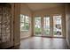 Bright living room with large windows and hardwood floors offering plenty of natural light at 2980 W Centennial Dr # L, Littleton, CO 80123