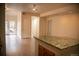 Open layout featuring seamless transitions from kitchen to the living area with recessed lights at 2980 W Centennial Dr # L, Littleton, CO 80123