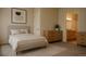 Serene main bedroom featuring neutral tones, soft carpeting, and natural light at 2980 W Centennial Dr # L, Littleton, CO 80123