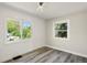 Bedroom featuring shiplap accent wall, recessed lighting, and updated windows at 3636 Ames St, Wheat Ridge, CO 80212