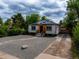 Charming home featuring solar panels, gravel landscaping, and a welcoming front entrance at 3636 Ames St, Wheat Ridge, CO 80212