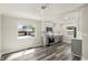 Updated kitchen featuring gray cabinetry, stainless appliances, and eat-in breakfast nook at 3636 Ames St, Wheat Ridge, CO 80212
